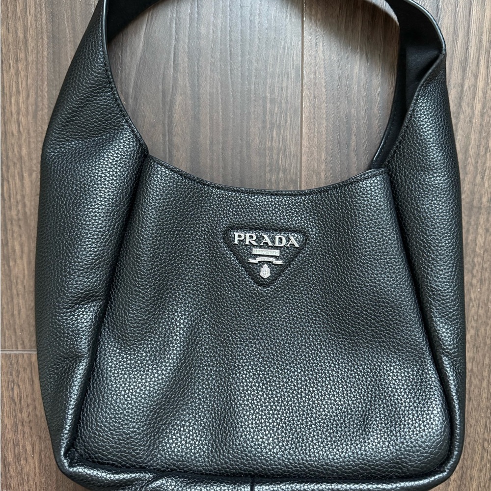 Prada pebbled Black Leather Bag multi pocket. Used. In great condition.
